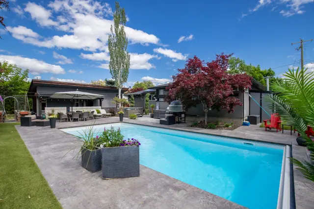 Backyard pool, modern home with pool in Glenmore, Kelowna, BC. Real estate photography by Pixel Pro Productions.