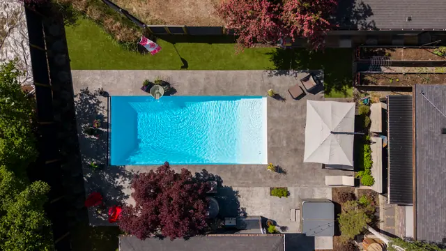 Pool from above, modern home with pool in Glenmore, Kelowna, BC. Real estate photography by Pixel Pro Productions.
