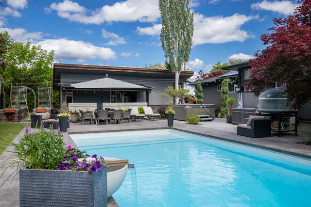 Pool patio, modern home with pool in Glenmore, Kelowna, BC. Real estate photography by Pixel Pro Productions.