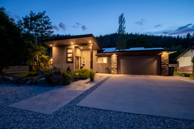 Twilight exterior 2, modern home with pool in Glenmore, Kelowna, BC. Real estate photography by Pixel Pro Productions.