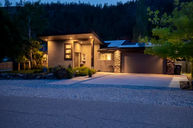 Twilight exterior, modern home with pool in Glenmore, Kelowna, BC. Real estate photography by Pixel Pro Productions.