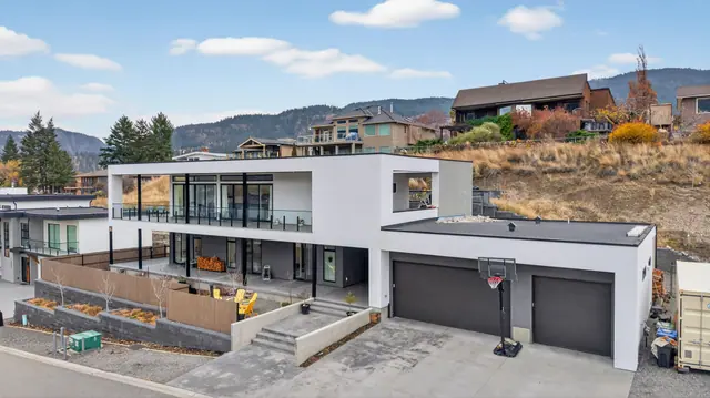 Aerial view exterior, modern lake-view home in Lake Country, BC. Real estate photography by Pixel Pro Productions.