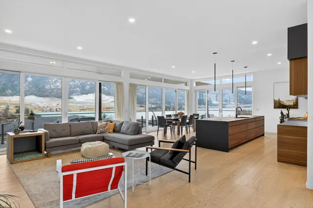 Great room, modern lake-view home in Lake Country, BC. Real estate photography by Pixel Pro Productions.
