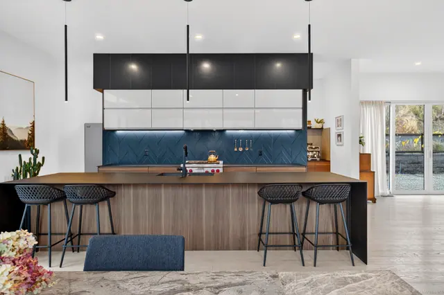 Kitchen island, modern lake-view home in Lake Country, BC. Real estate photography by Pixel Pro Productions.