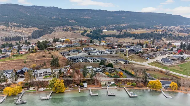Lakeshore aerial view, modern lake-view home in Lake Country, BC. Real estate photography by Pixel Pro Productions.