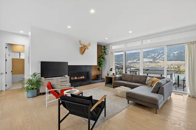 Living room, modern lake-view home in Lake Country, BC. Real estate photography by Pixel Pro Productions.