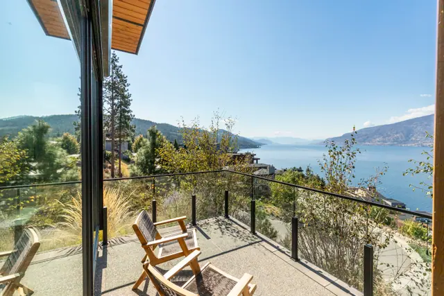 Deck lake view, lake-view modern home in Lakestone, Lake Country, BC. Real estate photography by Pixel Pro Productions.