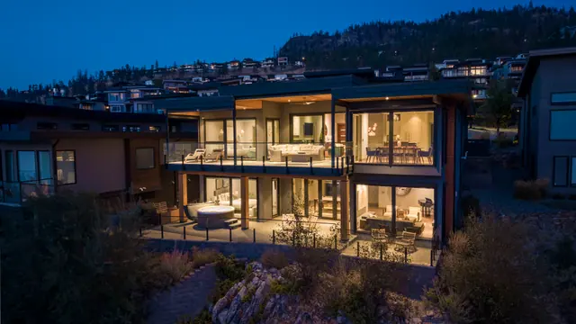 Twilight rear, lake-view modern home in Lakestone, Lake Country, BC. Real estate photography by Pixel Pro Productions.