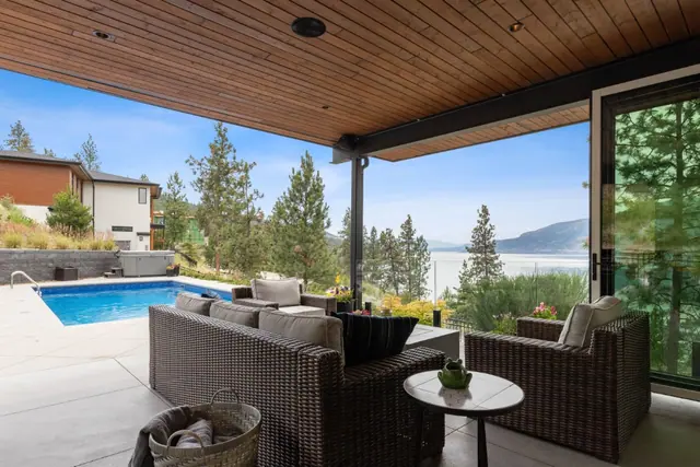 Covered patio lake view, luxury lake-view home in Lakestone, Lake Country, BC. Real estate photography by Pixel Pro Productions.