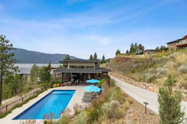 Pool aerial view, luxury lake-view home in Lakestone, Lake Country, BC. Real estate photography by Pixel Pro Productions.