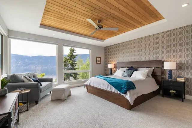Primary bedroom lake view, luxury lake-view home in Lakestone, Lake Country, BC. Real estate photography by Pixel Pro Productions.