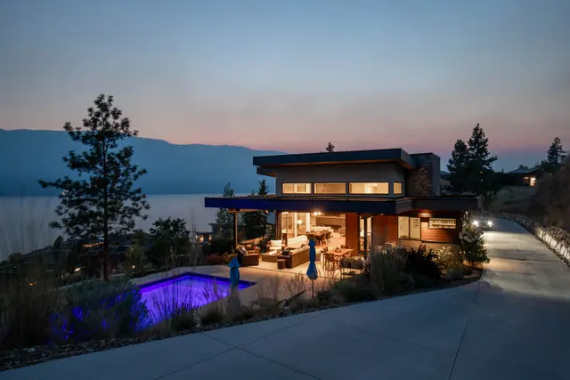 Twilight exterior pool, luxury lake-view home in Lakestone, Lake Country, BC. Real estate photography by Pixel Pro Productions.
