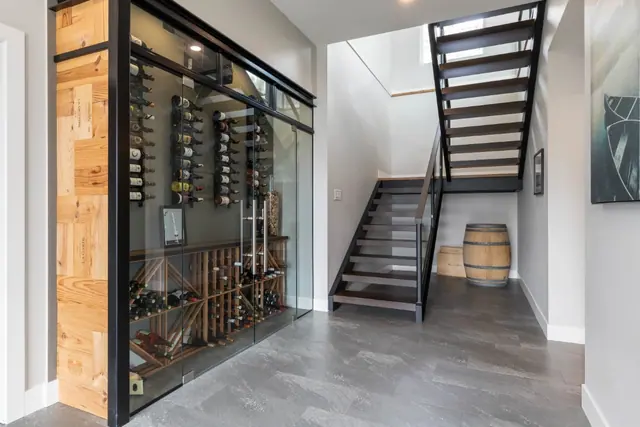 Wine room, luxury lake-view home in Lakestone, Lake Country, BC. Real estate photography by Pixel Pro Productions.