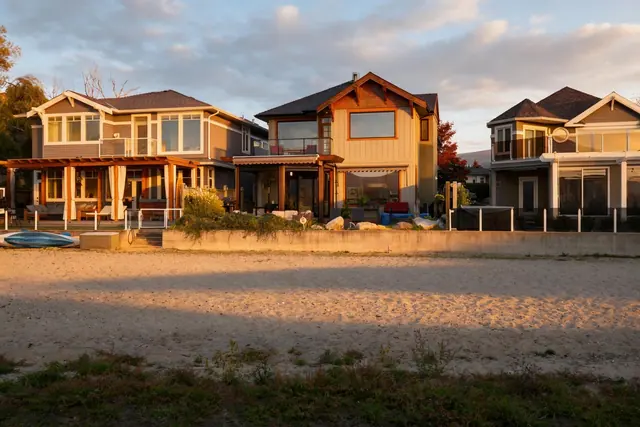 Beachfront sunset, lakefront home renovation in Lower Mission, Kelowna, BC. Real estate photography by Pixel Pro Productions.