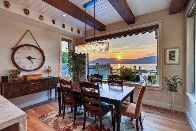 Dining room lake view, lakefront home renovation in Lower Mission, Kelowna, BC. Real estate photography by Pixel Pro Productions.