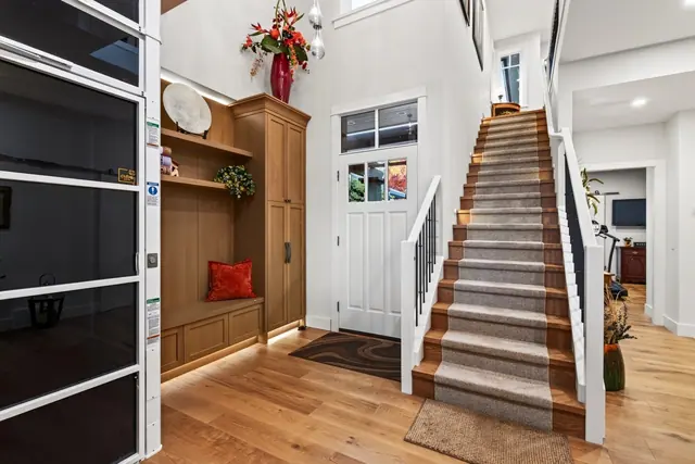 Entry staircase, lakefront home renovation in Lower Mission, Kelowna, BC. Real estate photography by Pixel Pro Productions.