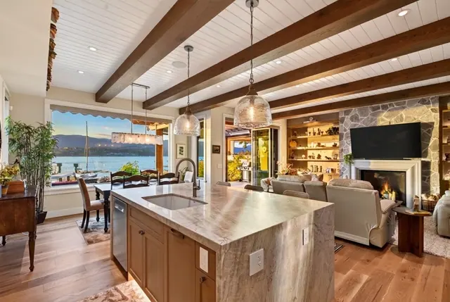 Kitchen island lake view, lakefront home renovation in Lower Mission, Kelowna, BC. Real estate photography by Pixel Pro Productions.