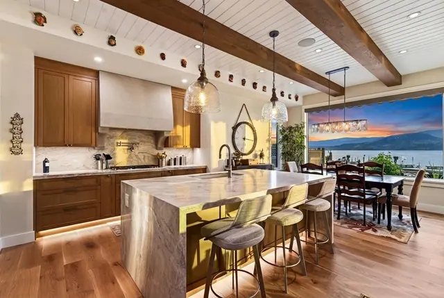 Kitchen lake view sunset, lakefront home renovation in Lower Mission, Kelowna, BC. Real estate photography by Pixel Pro Productions.