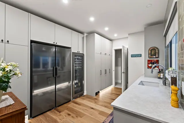Kitchen pantry wall, lakefront home renovation in Lower Mission, Kelowna, BC. Real estate photography by Pixel Pro Productions.
