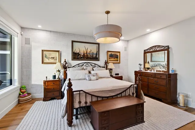 Primary bedroom, lakefront home renovation in Lower Mission, Kelowna, BC. Real estate photography by Pixel Pro Productions.