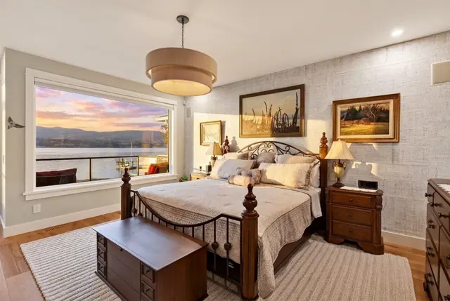 Primary bedroom lake view, lakefront home renovation in Lower Mission, Kelowna, BC. Real estate photography by Pixel Pro Productions.