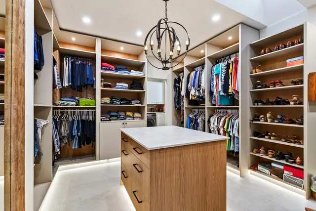 Walk in closet, lakefront home renovation in Lower Mission, Kelowna, BC. Real estate photography by Pixel Pro Productions.