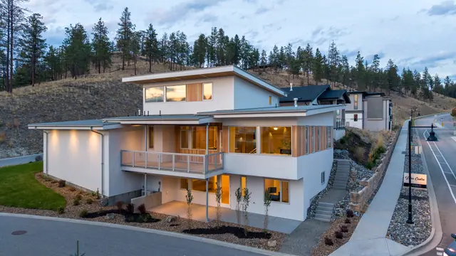 Aerial view evening, modern new build in McKinley Beach, Kelowna, BC. Real estate photography by Pixel Pro Productions.