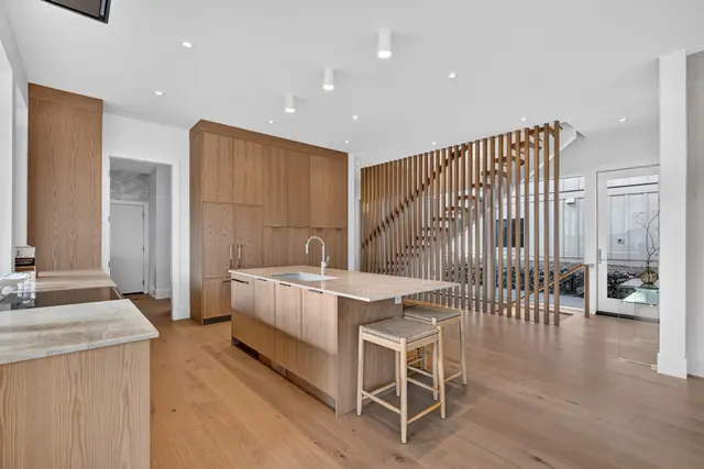 Kitchen staircase, modern new build in McKinley Beach, Kelowna, BC. Real estate photography by Pixel Pro Productions.
