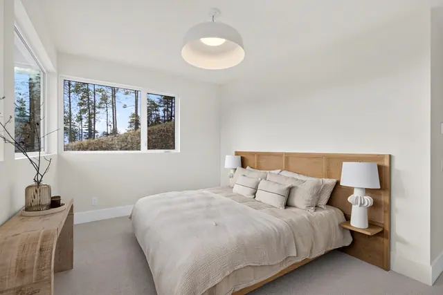 Primary bedroom, modern new build in McKinley Beach, Kelowna, BC. Real estate photography by Pixel Pro Productions.