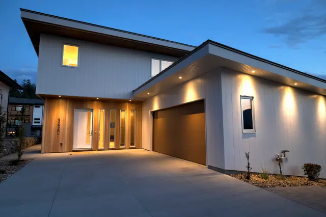 Twilight entry, modern new build in McKinley Beach, Kelowna, BC. Real estate photography by Pixel Pro Productions.