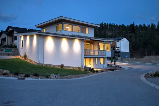 Twilight side, modern new build in McKinley Beach, Kelowna, BC. Real estate photography by Pixel Pro Productions.