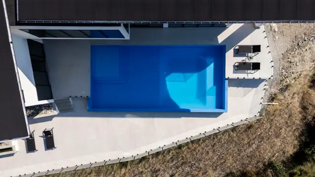 Pool from above, luxury hillside estate in Vernon, BC. Real estate photography by Pixel Pro Productions.