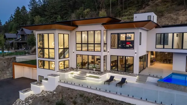 Twilight pool, luxury hillside estate in Vernon, BC. Real estate photography by Pixel Pro Productions.