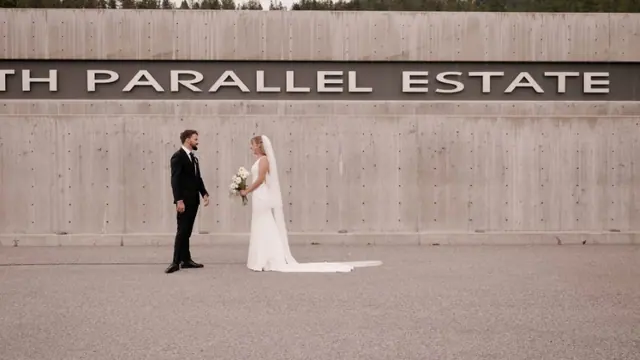 Estate sign portrait: Emily & Connor's wedding at 50th Parallel Estate, Lake Country. Still from the Pixel Pro wedding film.