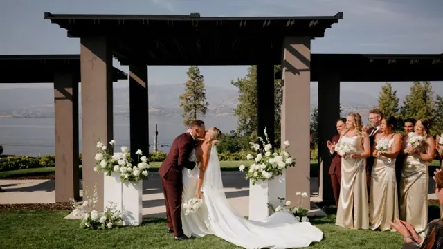 Ceremony kiss: Carlee & Ryan's wedding at CedarCreek Estate Winery, Kelowna. Still from the Pixel Pro wedding film.