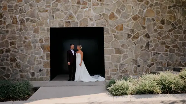 Stone doorway portrait: Carlee & Ryan's wedding at CedarCreek Estate Winery, Kelowna. Still from the Pixel Pro wedding film.