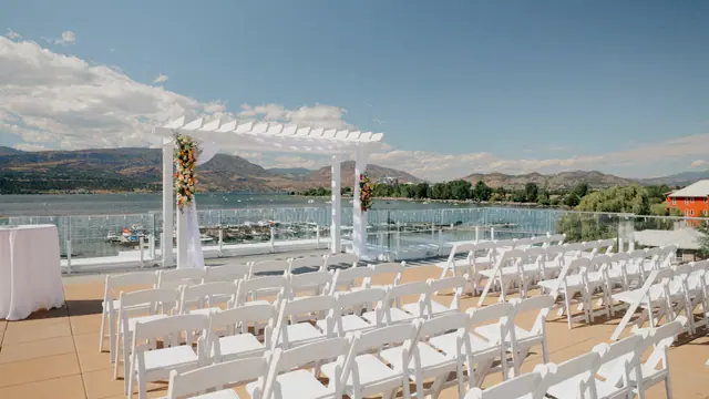 Rooftop ceremony setup: Bronte & Brett's wedding at Manteo Resort, Kelowna. Still from the Pixel Pro wedding film.