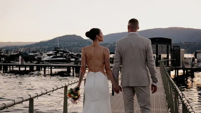 Sunset walk on the dock: Bronte & Brett's wedding at Manteo Resort, Kelowna. Still from the Pixel Pro wedding film.
