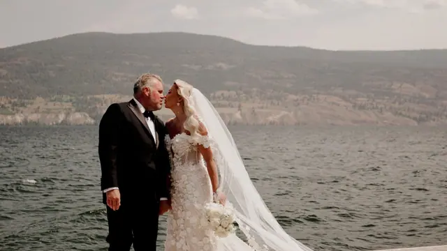 Lakeside kiss: Laurie & Brad's wedding at Vows and Vines, Summerland. Still from the Pixel Pro wedding film.