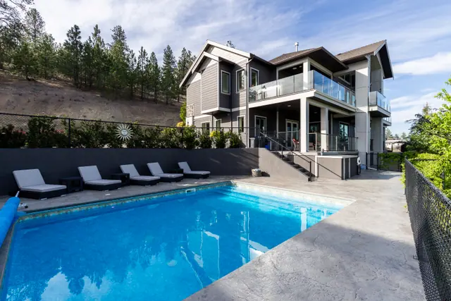 Backyard pool, lake-view family home in West Kelowna, BC. Real estate photography by Pixel Pro Productions.