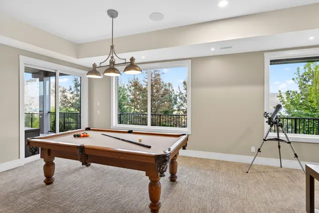 Games room, lake-view family home in West Kelowna, BC. Real estate photography by Pixel Pro Productions.