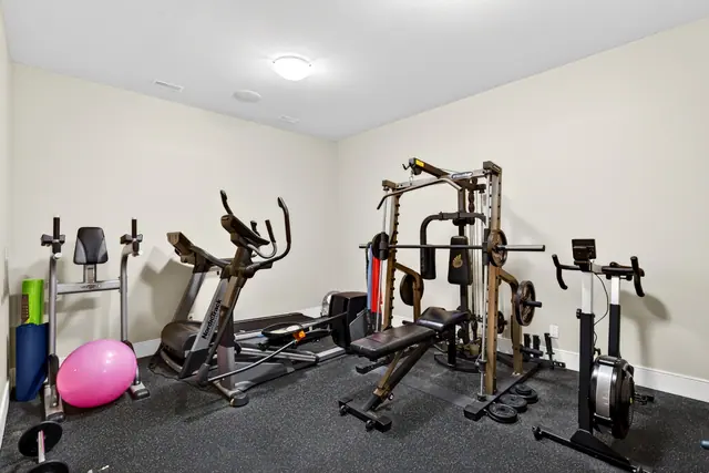 Home gym, lake-view family home in West Kelowna, BC. Real estate photography by Pixel Pro Productions.