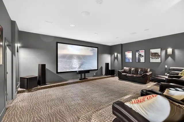 Home theatre, lake-view family home in West Kelowna, BC. Real estate photography by Pixel Pro Productions.