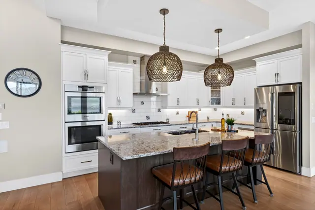 Kitchen island, lake-view family home in West Kelowna, BC. Real estate photography by Pixel Pro Productions.