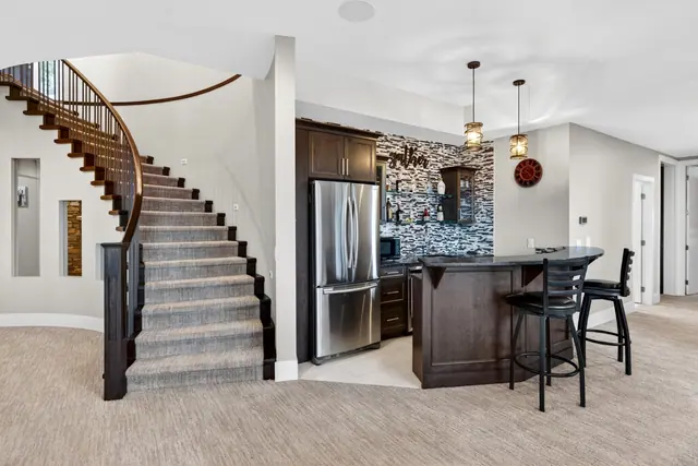 Lower level bar, lake-view family home in West Kelowna, BC. Real estate photography by Pixel Pro Productions.