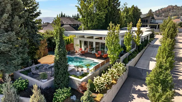 Aerial view backyard pool, mid-century modern home in West Kelowna, BC. Real estate photography by Pixel Pro Productions.