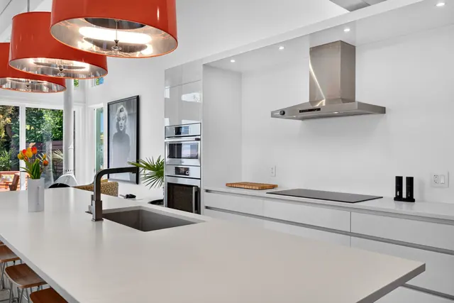 Kitchen island, mid-century modern home in West Kelowna, BC. Real estate photography by Pixel Pro Productions.