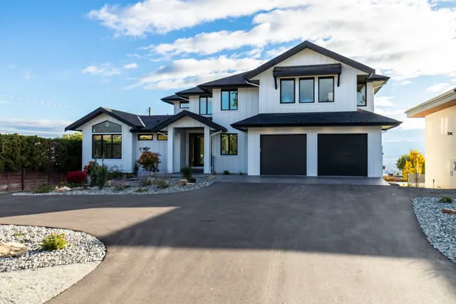 Front exterior 2, new-build lake-view home in West Kelowna, BC. Real estate photography by Pixel Pro Productions.