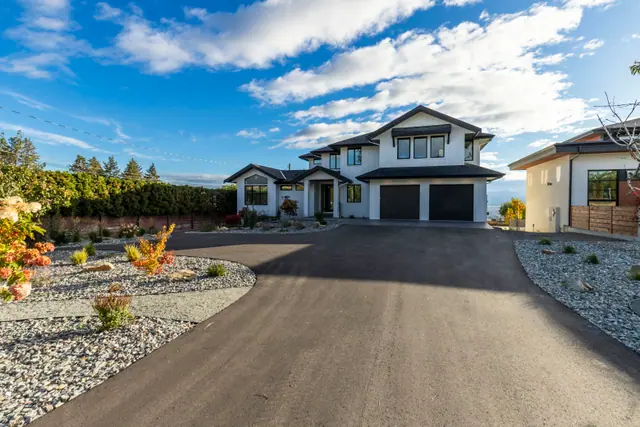 Front exterior, new-build lake-view home in West Kelowna, BC. Real estate photography by Pixel Pro Productions.
