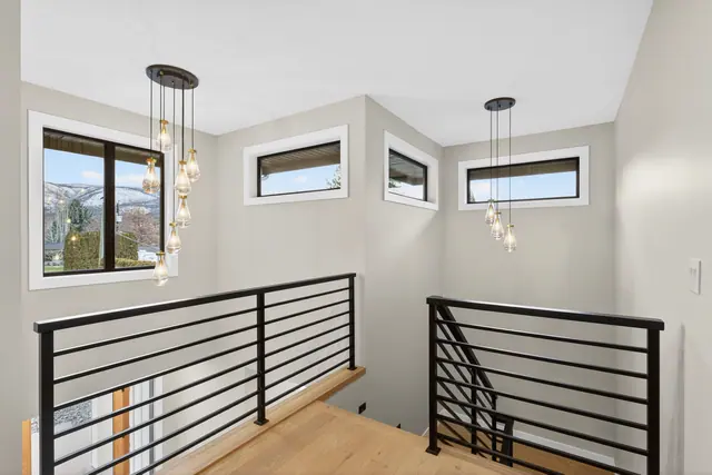 Staircase landing, new-build lake-view home in West Kelowna, BC. Real estate photography by Pixel Pro Productions.